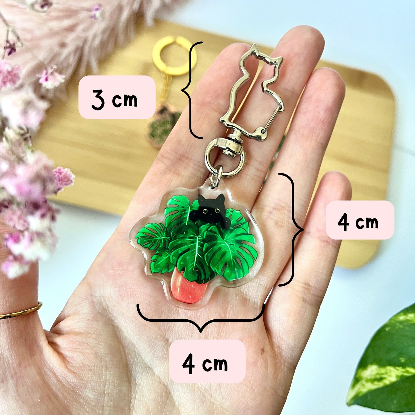 Schlüsselanhänger - schwarze Katze mit Monstera deliciosa aus Epoxidharz